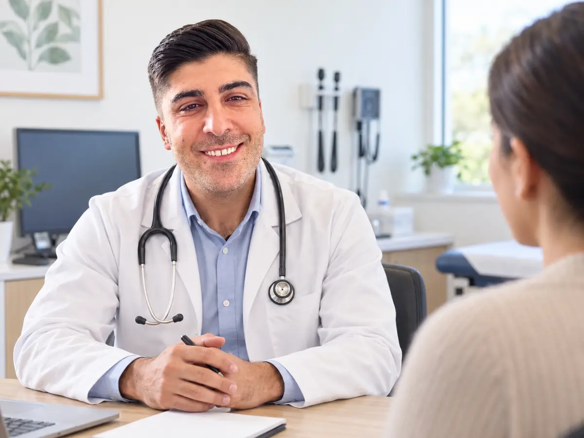 Young male general practitioner consulting with a patient